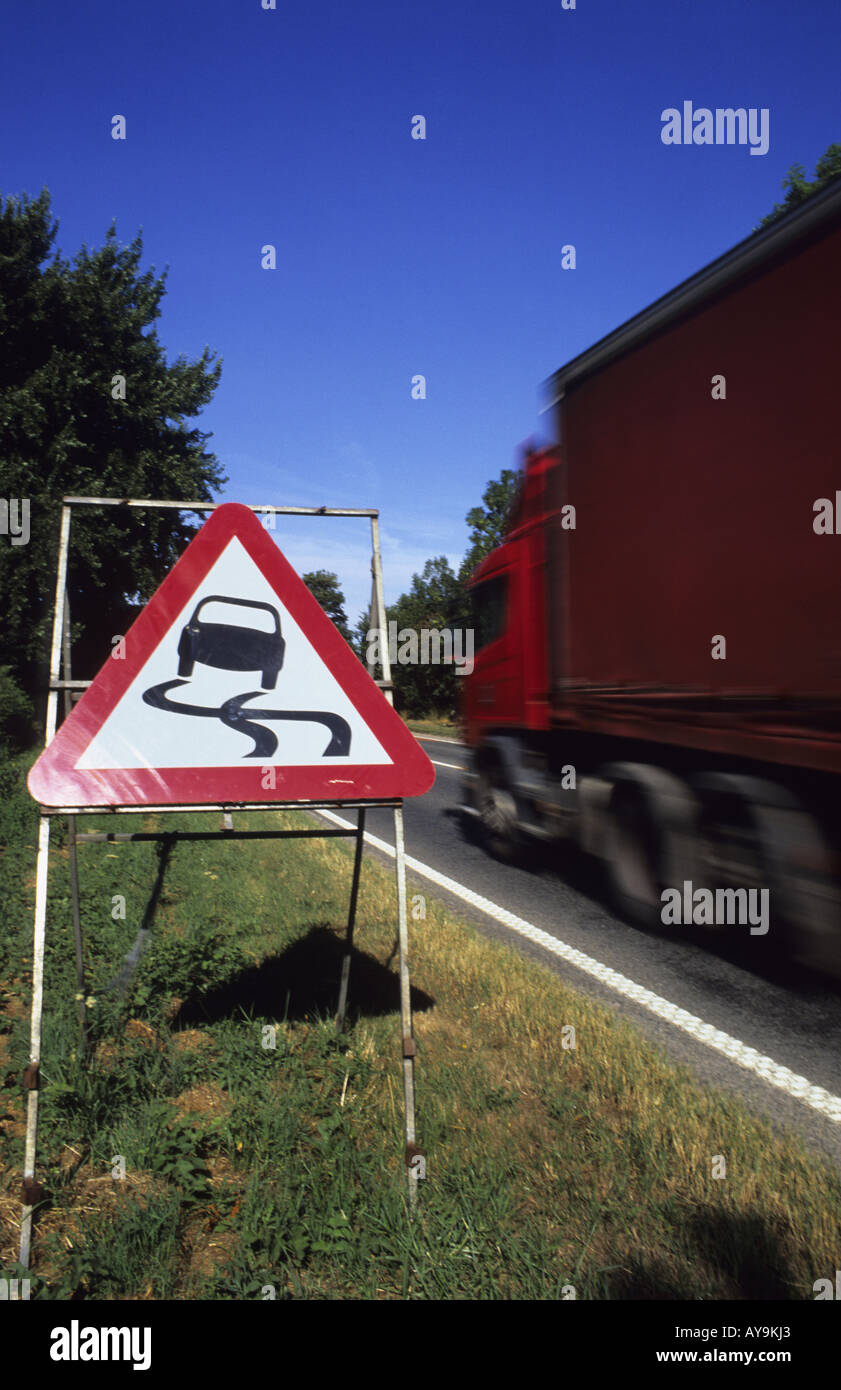 lorry-passing-warning-sign-of-slippery-road-surface-ahead-leeds