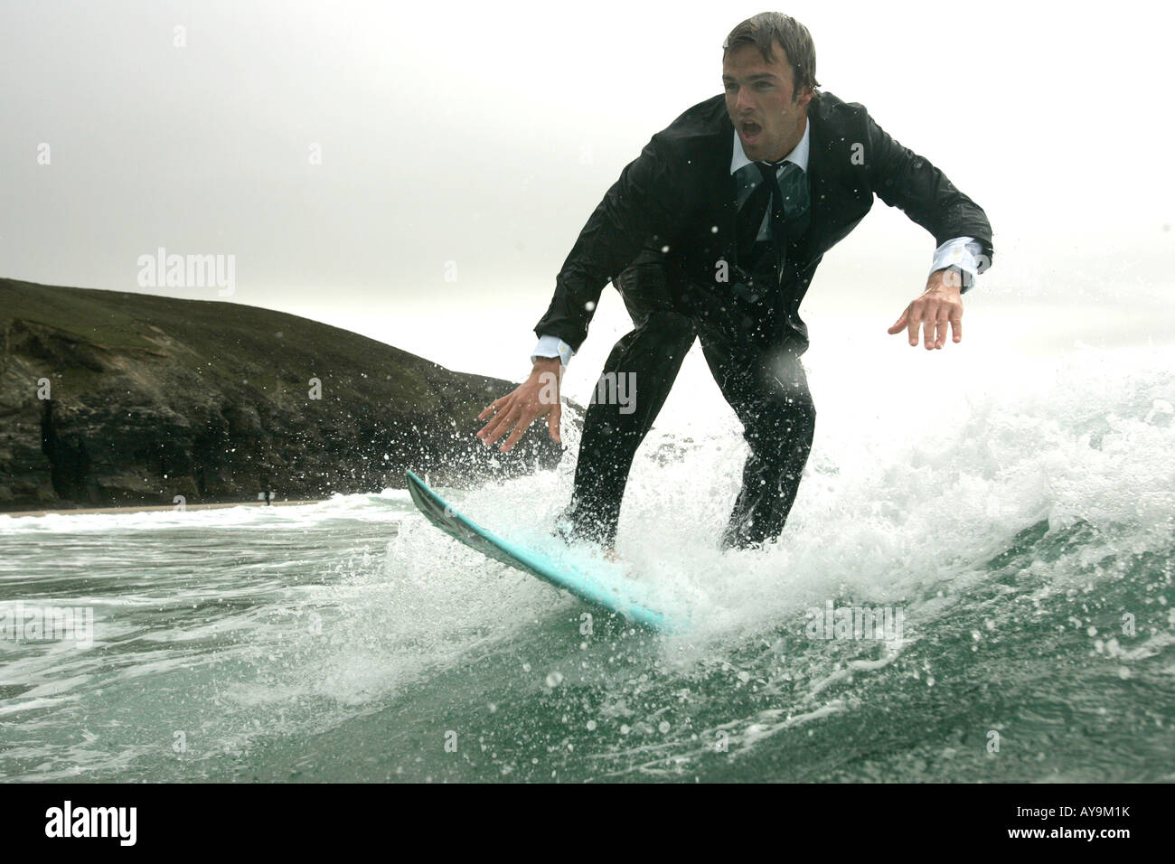 SURFER JOSS ASH SURFING IN A SUIT Stock Photo Alamy