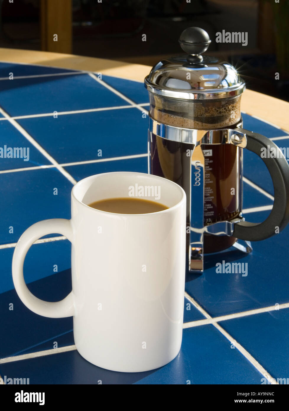 A mug of coffee with cafetiere Stock Photo