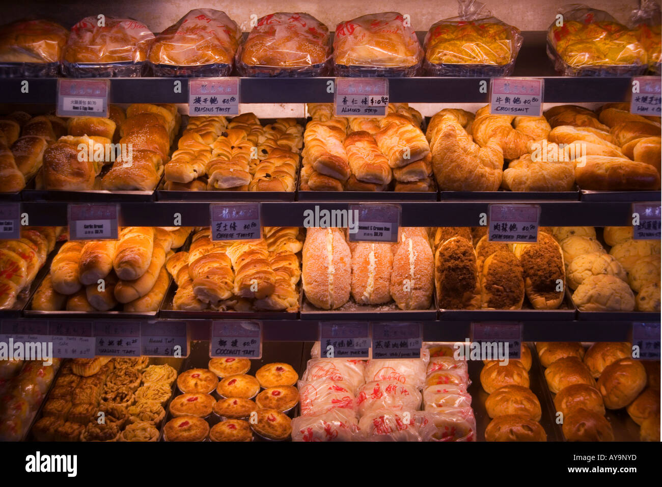 Fresh pastries are for sale at at an ethnic bakery on Canal Street in the Chinatown district of lower Manhattan New York City Stock Photo