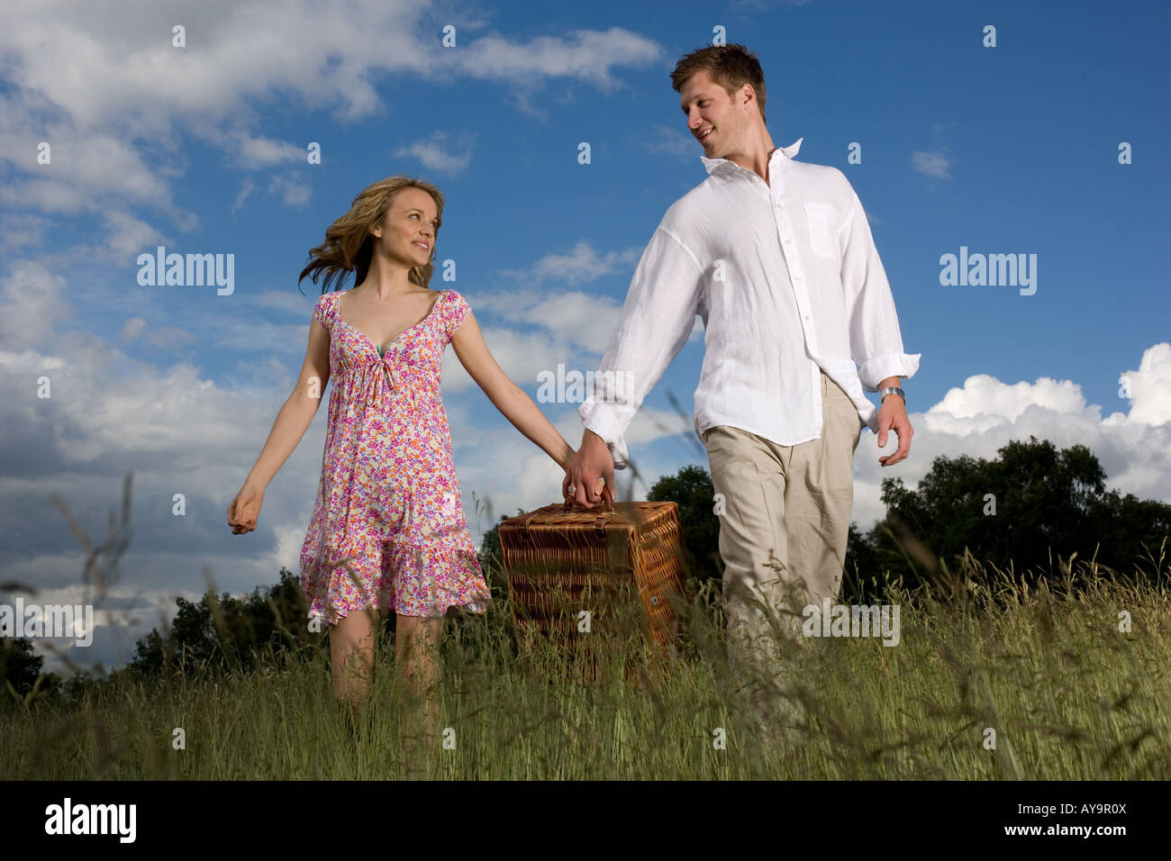 Couple on summer picnic with hamper Stock Photo