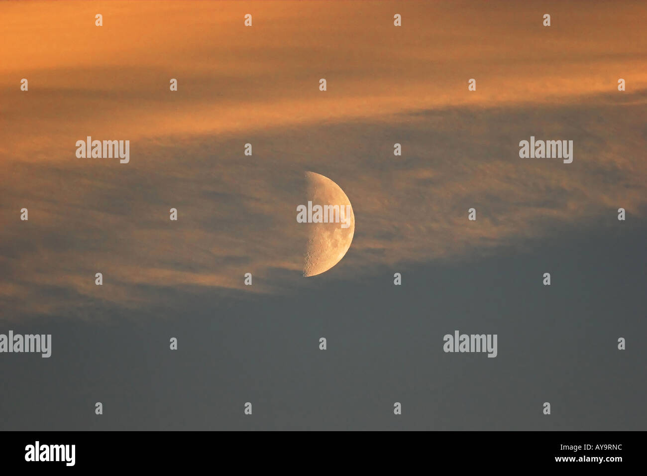 A half moon rising at Sunset Banff national park canadian rockies Stock ...