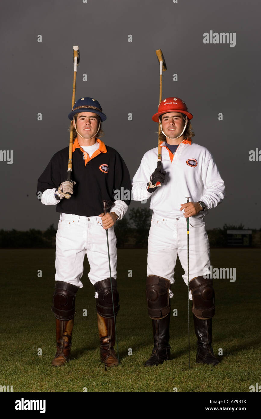 Polo players with mallets Stock Photo