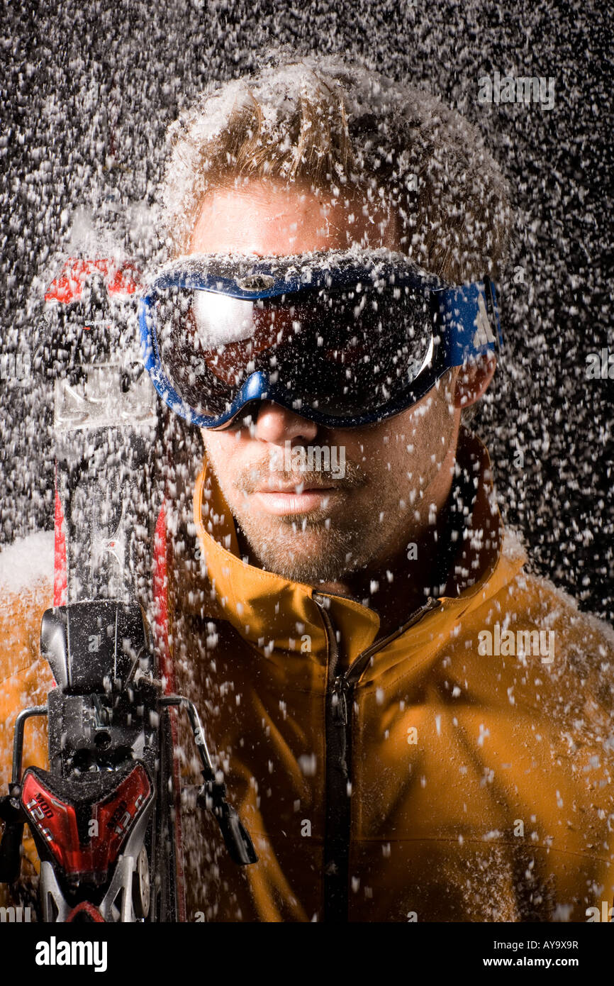Man modelling skiwear in artificial snow Stock Photo Alamy