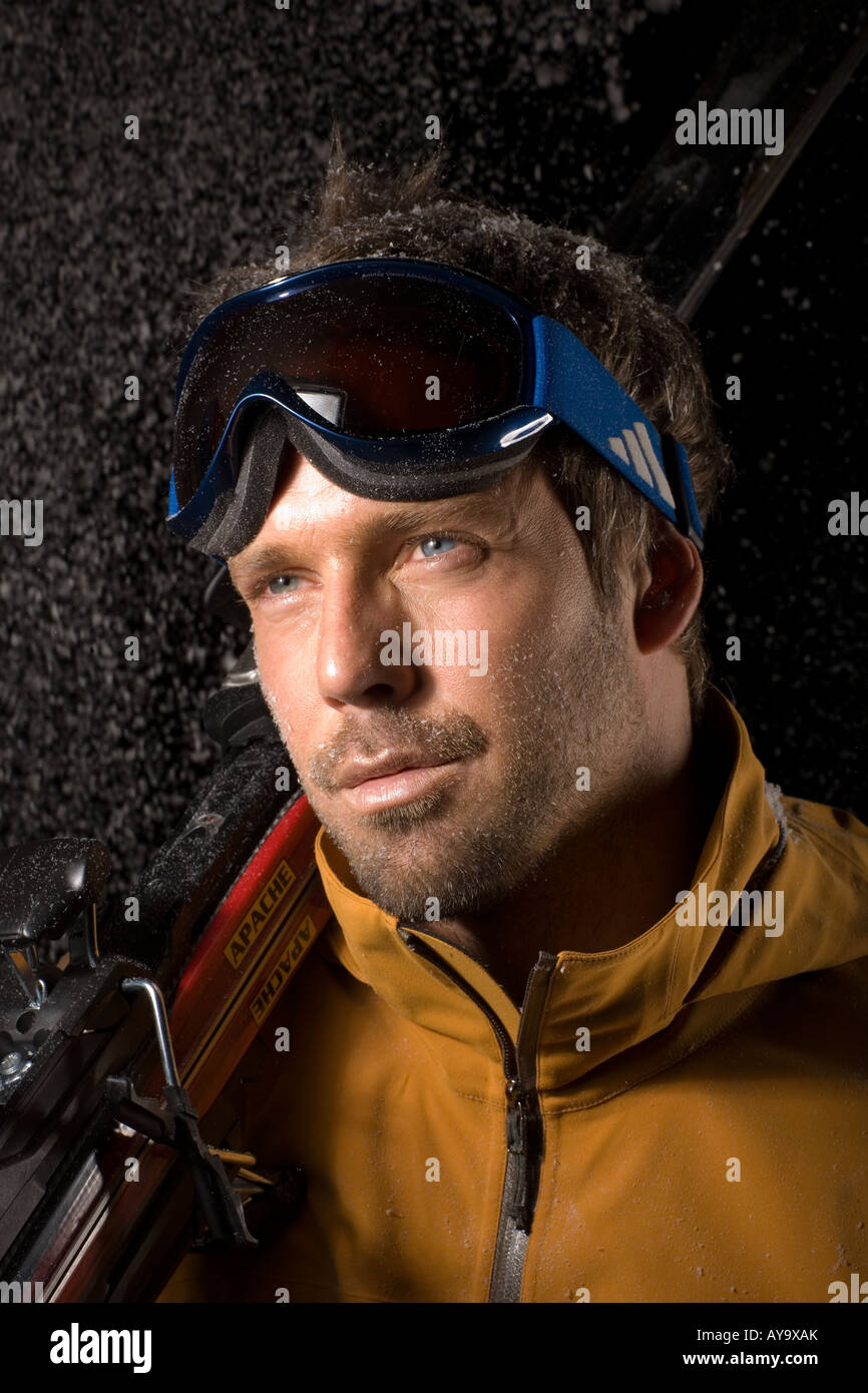 Man modelling skiwear in artificial snow Stock Photo