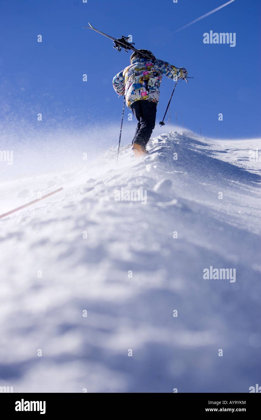 Skier carrying equipment uphill, Tignes, France Stock Photo Alamy
