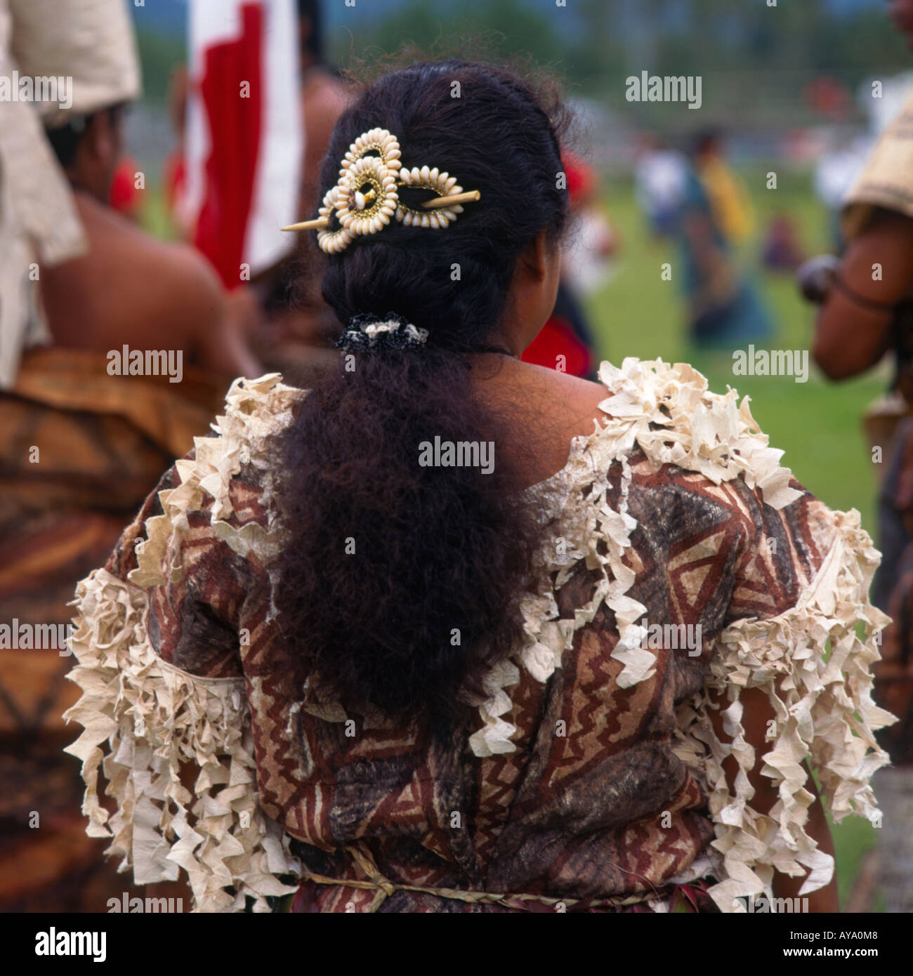 Female dancer from Futuna Island in flowery tapa cloth costume and cowrie shell hair ornament at Festival of Pacific Arts Stock Photo