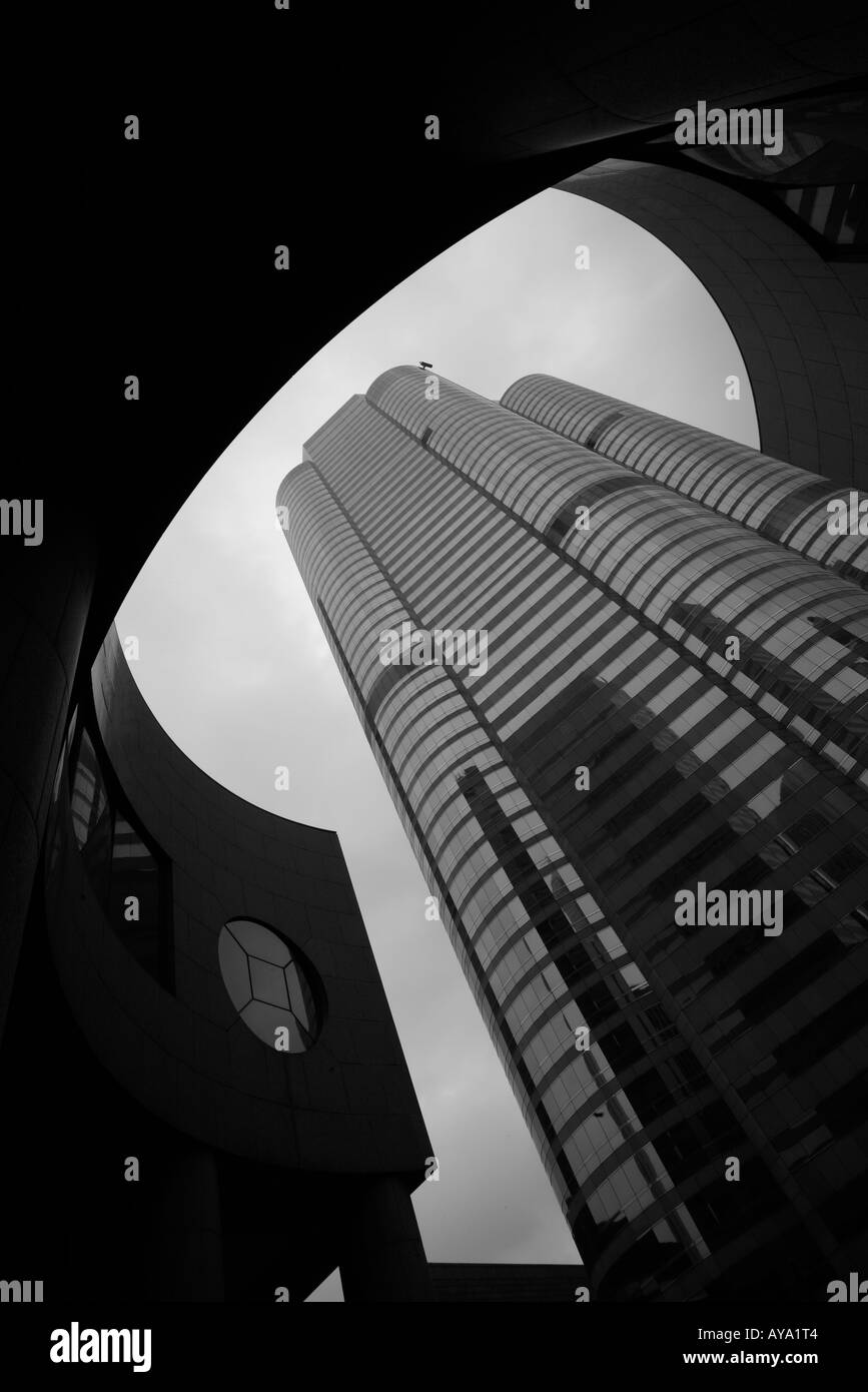 Asia Peoples Republic of China Hong Kong View looking up at curved steel and glass exterior of buildings at One and Two Stock Photo