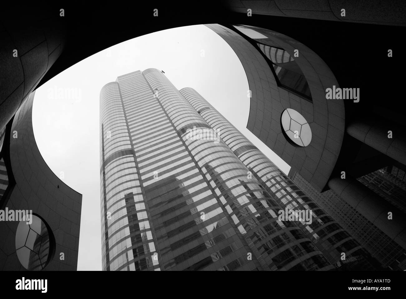 Asia Peoples Republic of China Hong Kong View looking up at curved steel and glass exterior of buildings at One and Two Stock Photo