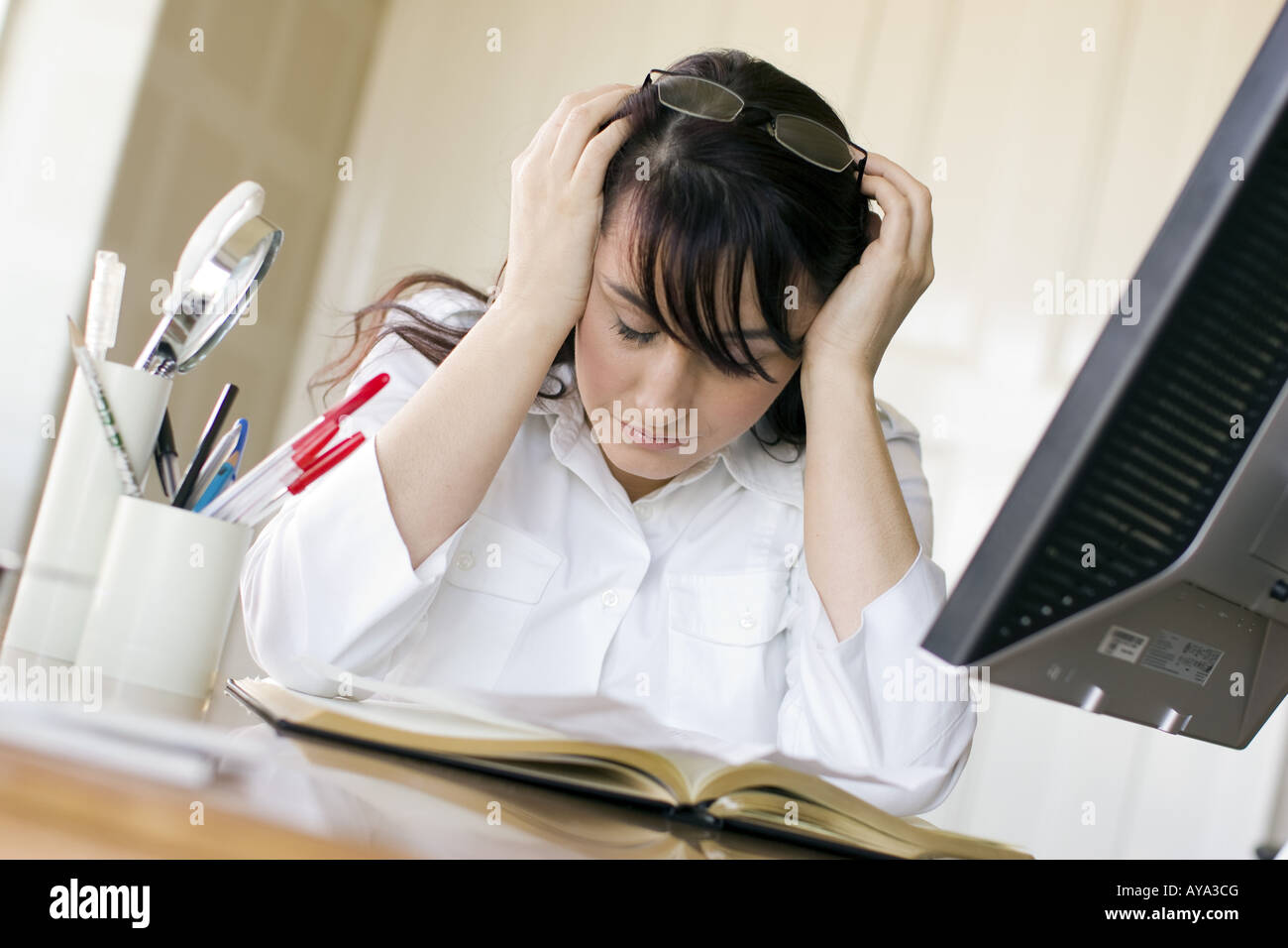 Frustrated woman using computer Stock Photo