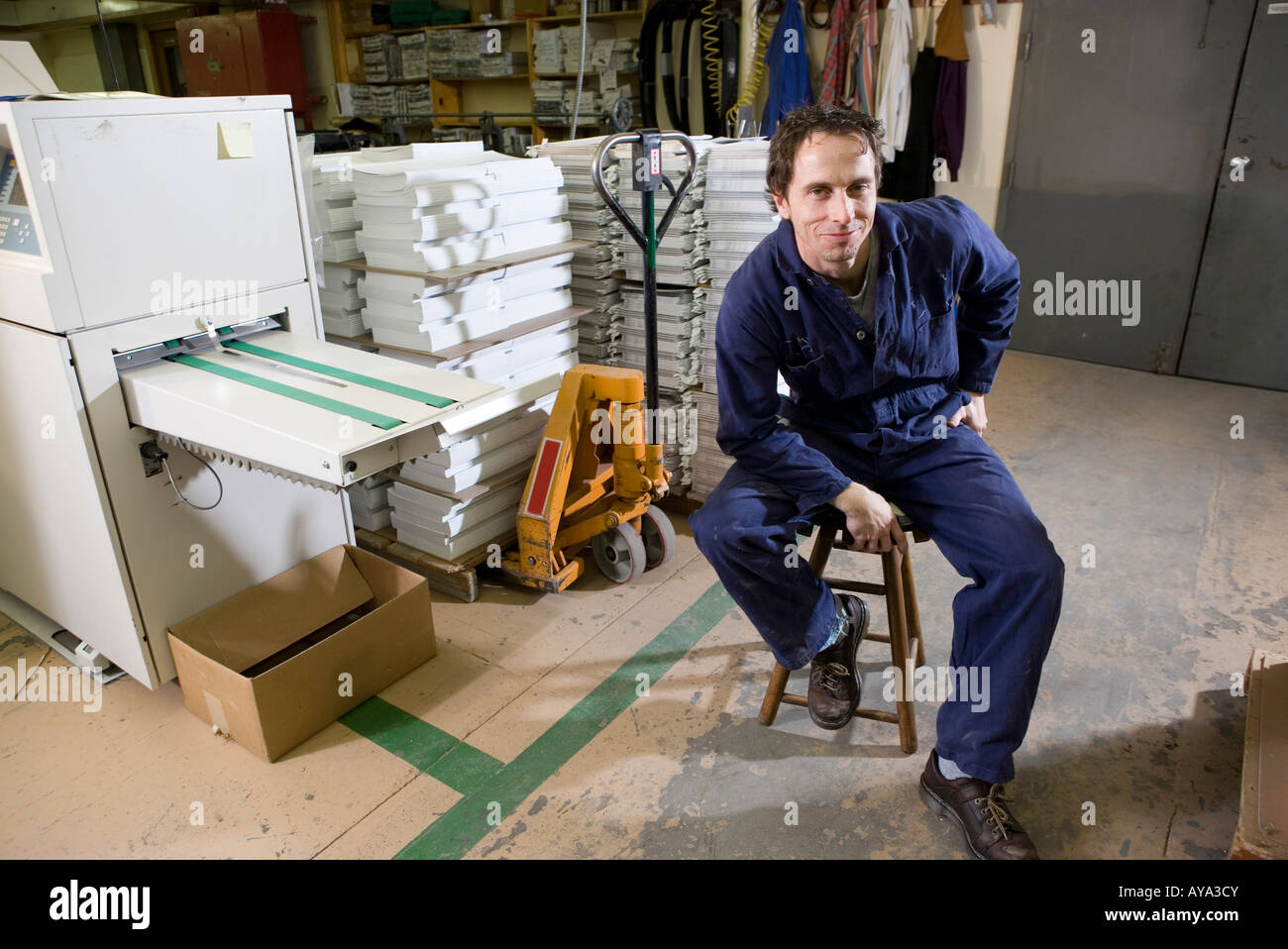 Employee Sitting On Stool High Resolution Stock Photography and Images ...