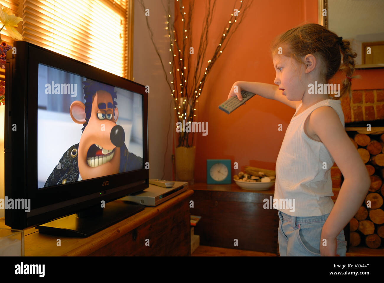 4 yearold girl watching cartoons on television at home in Suffolk, UK