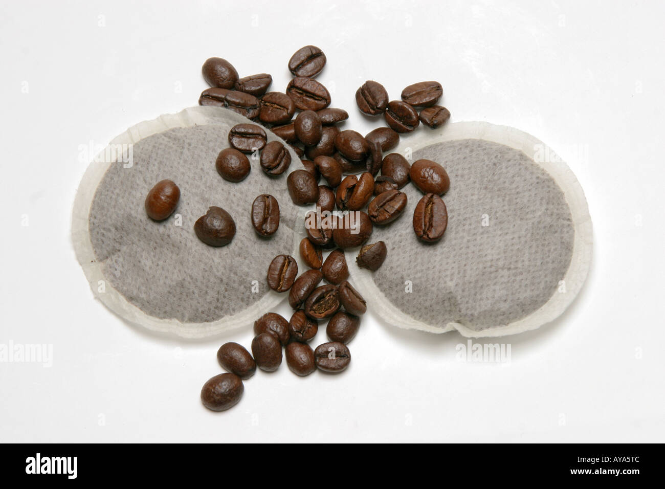 Coffe-beans and modern coffee-pads Stock Photo