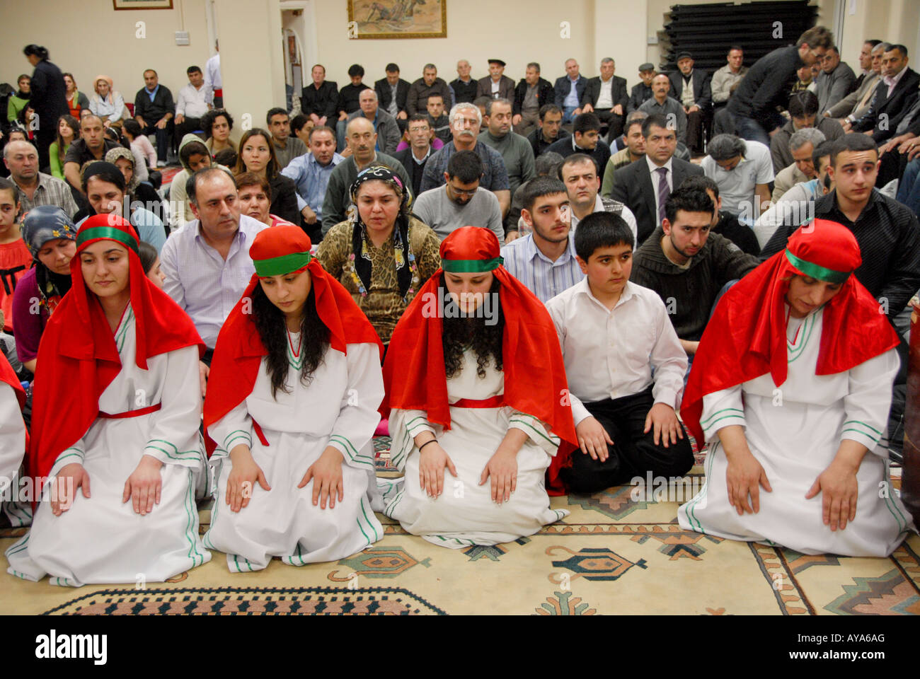TURKISH FEMALE ALEVIS IN SEMAH CERAMONY,IN ALEVIS CULTURAL CENTER IN NORTH LONDON Stock Photo