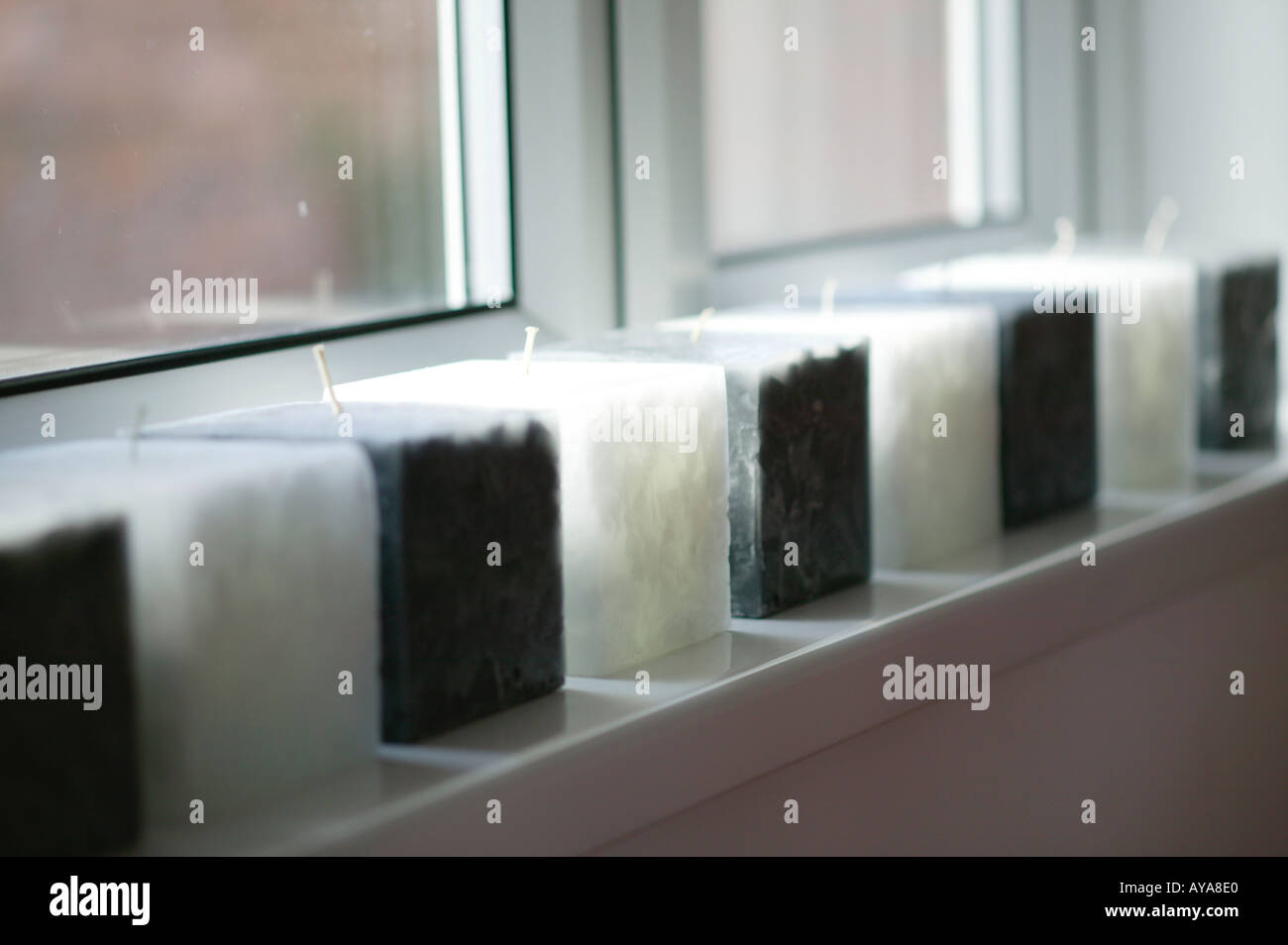 candles on window sill of modern home Stock Photo Alamy