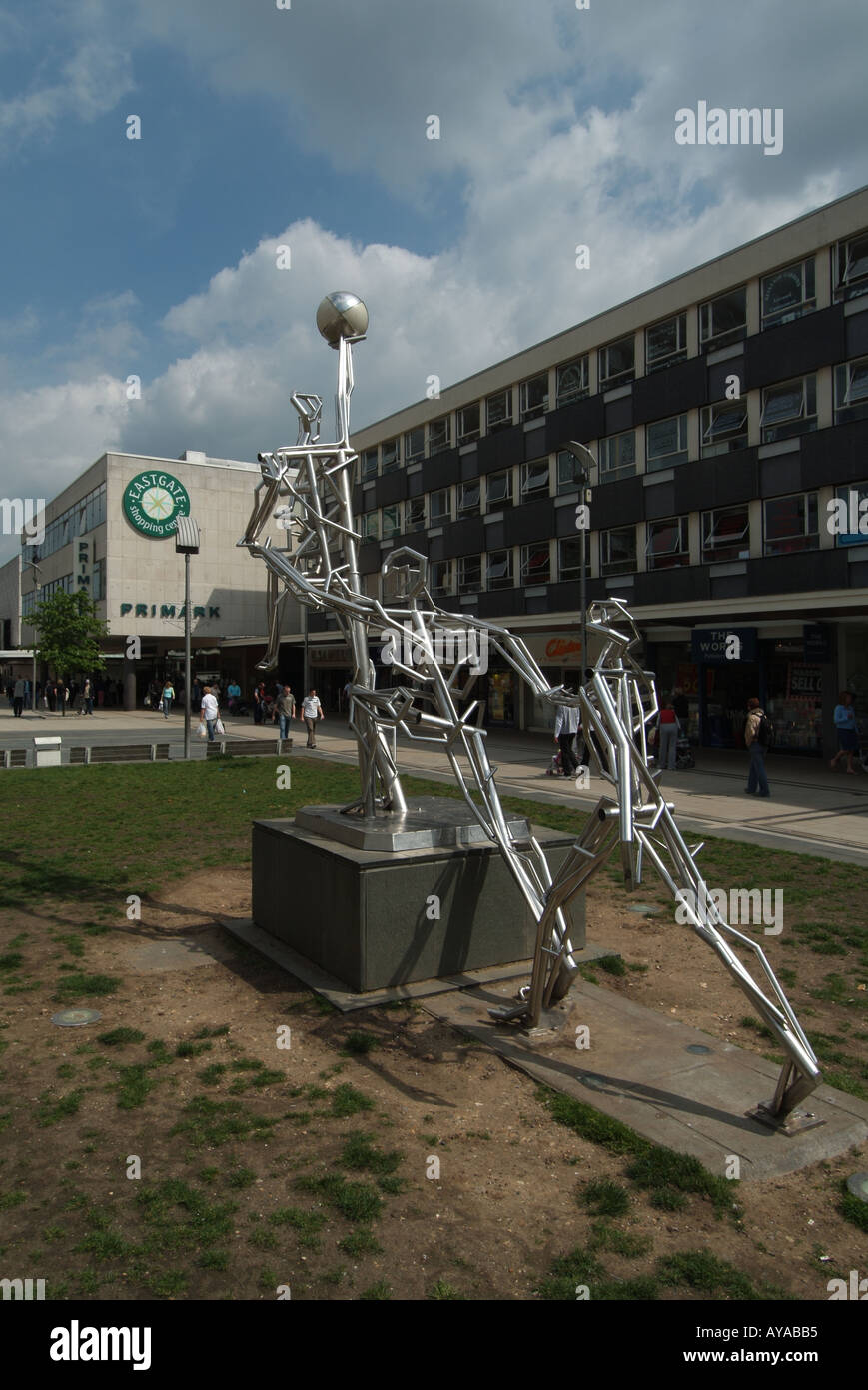 Basildon new town centre open space with shop units modern sculpture ...