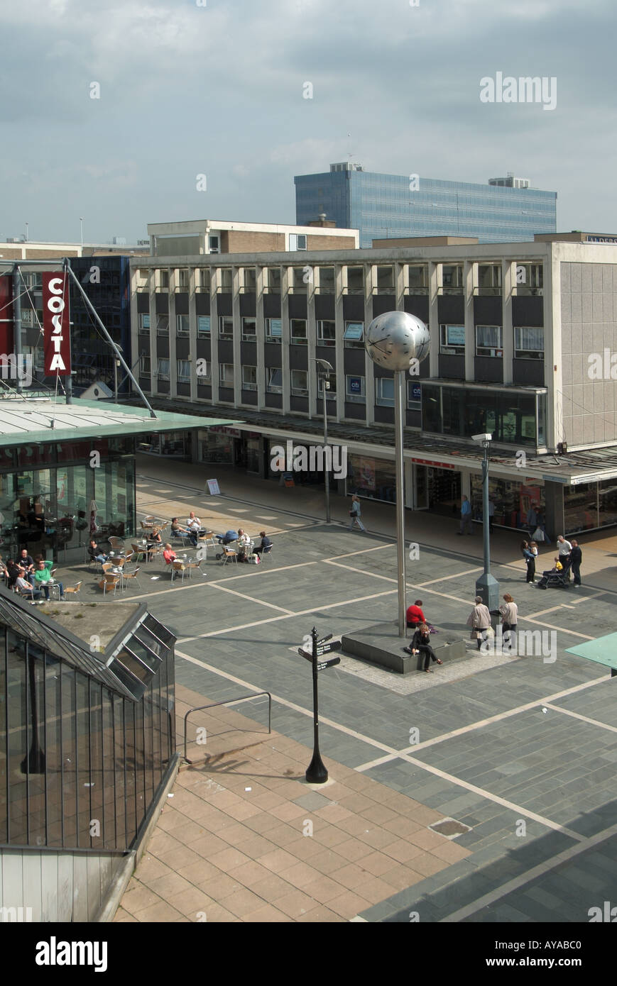 Basildon new town centre open space with Costa coffe shop with pavement seats and tables shop units beyond Stock Photo