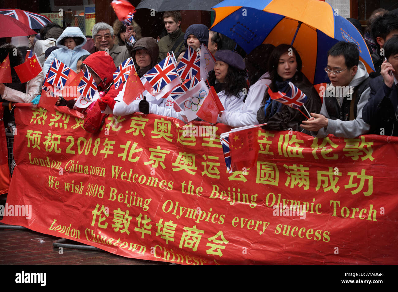 London's Chinatown community welcome the Chinese Beijing Olympic torch making its way through 31 miles of the capital's streets Stock Photo