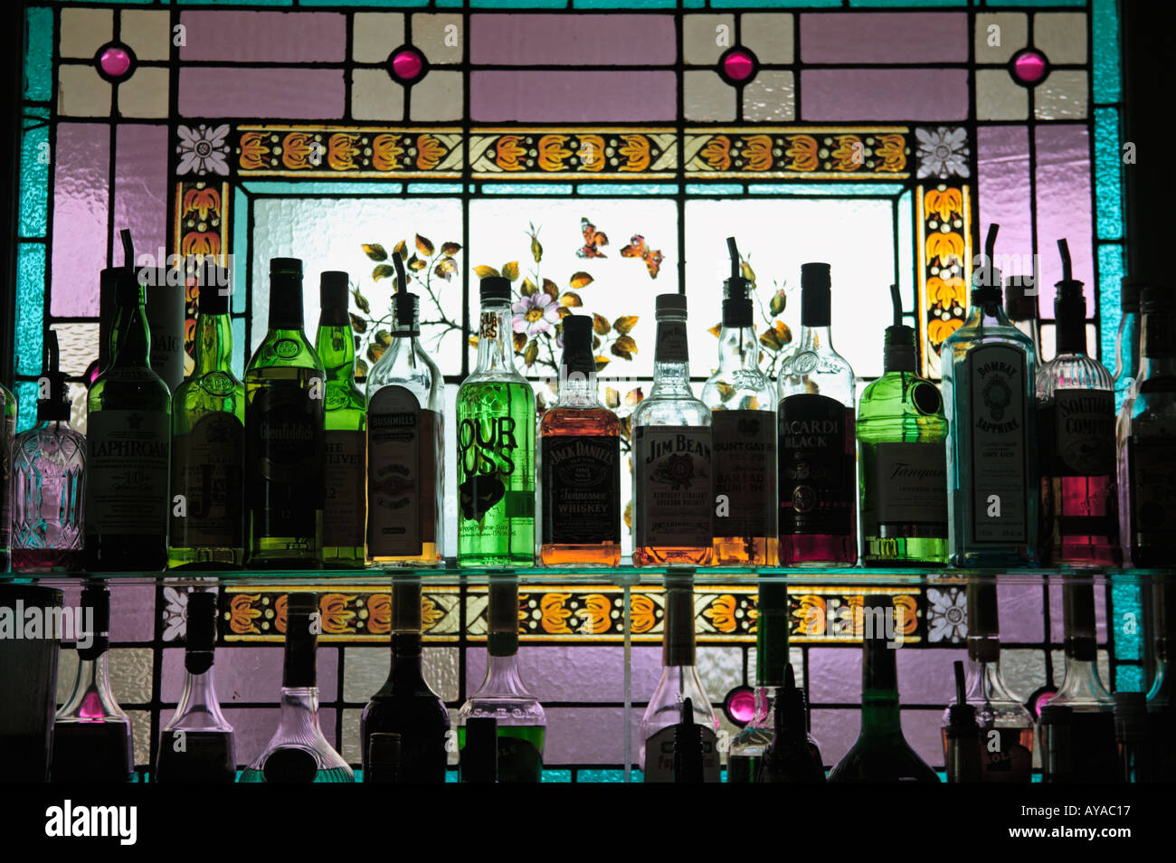 Stained glass window and liquor bottles Stock Photo Alamy