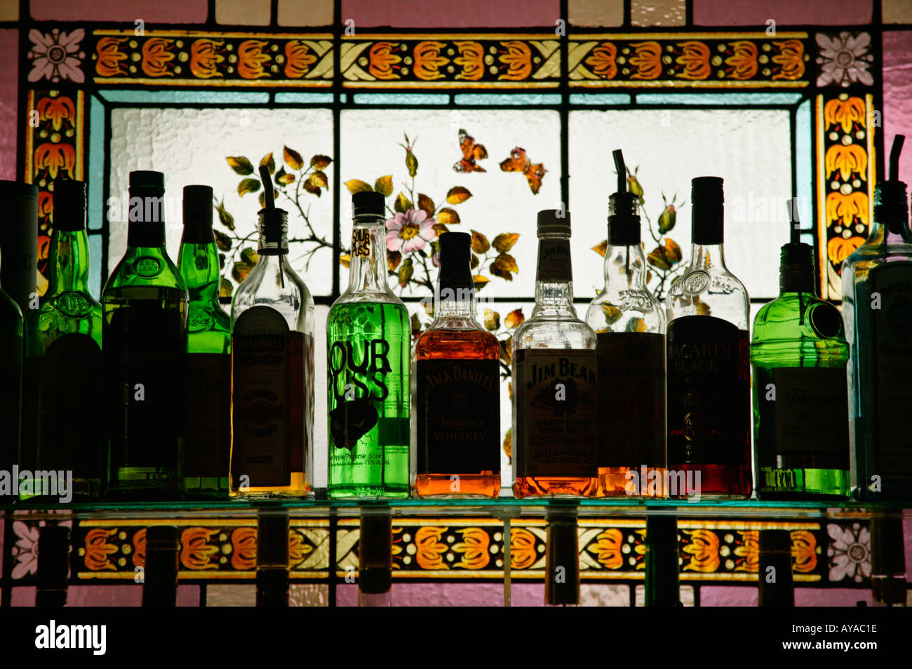Stained glass window and liquor bottles Stock Photo Alamy