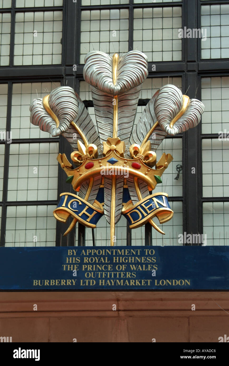 Haymarket London Royal Warrant crest over Burberry store for outfitters to  the Prince of Wales Stock Photo - Alamy