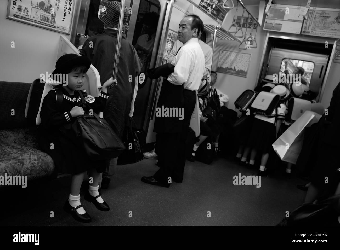 Asia Tokyo Japan Young school girl in uniform on subway train Stock Photo