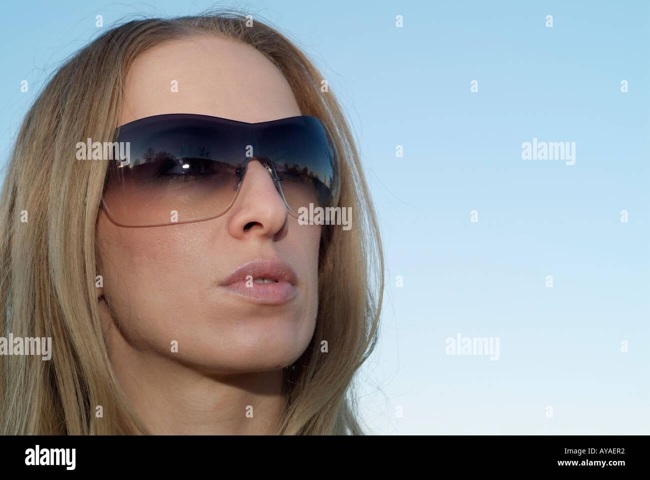 Female Wearing Sunglasses Close Up Face Shot Stock Photo