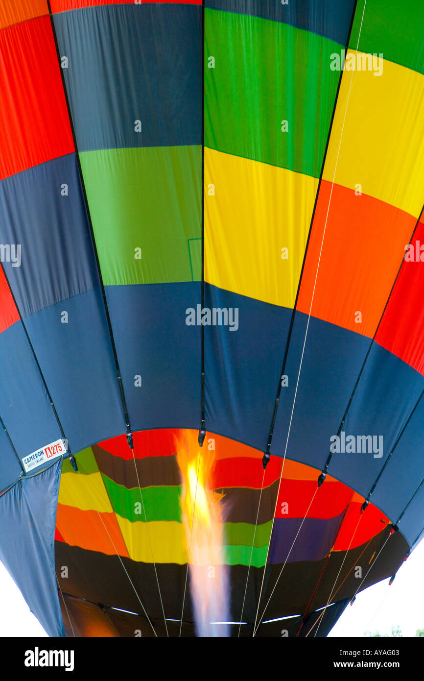 Gas flames inflating a colourful hot air balloon Stock Photo