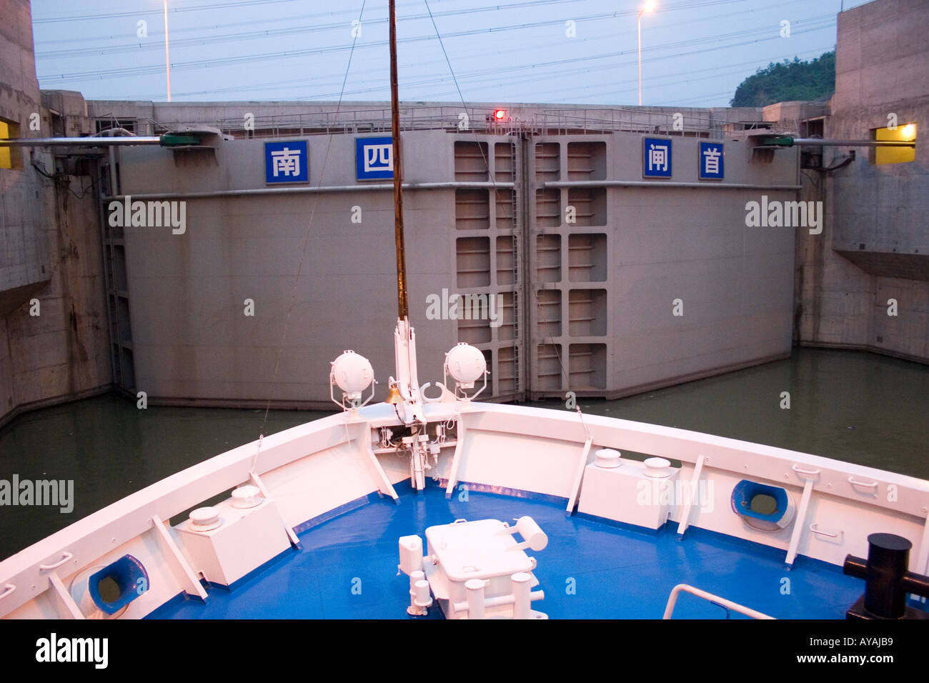 River passenger cruise ship tied up in a lock waiting for the lock gate