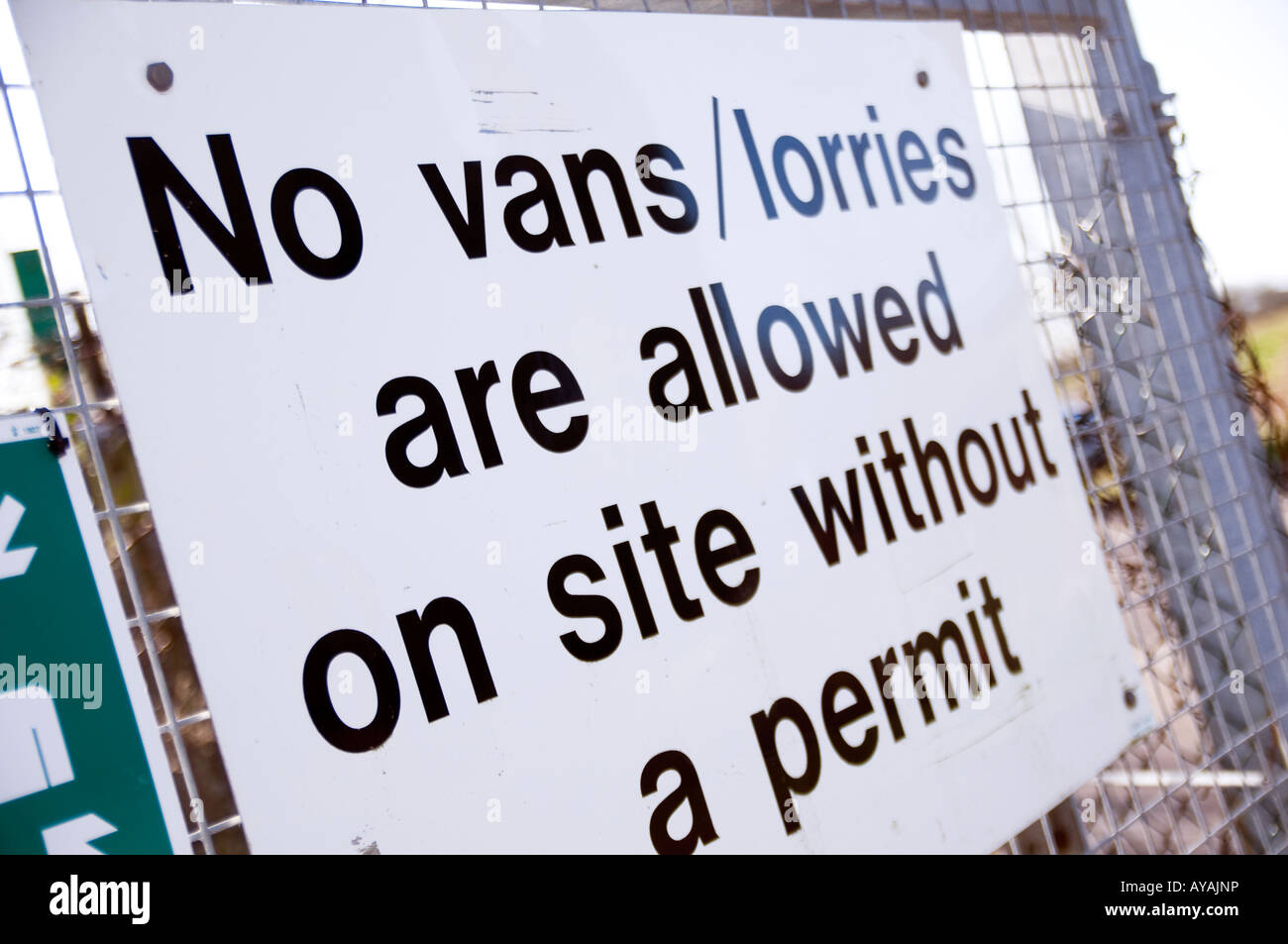 no van lorries on site without a permit white metal sign on a fence Stock Photo