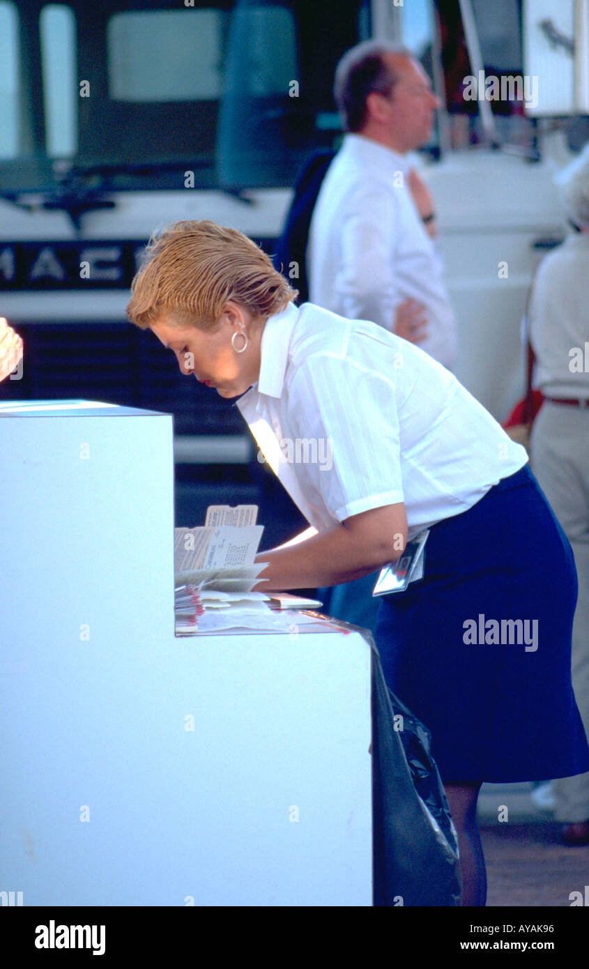 Cruise ship ticket agent age 34 checking baggage. San Juan Puerto Rico