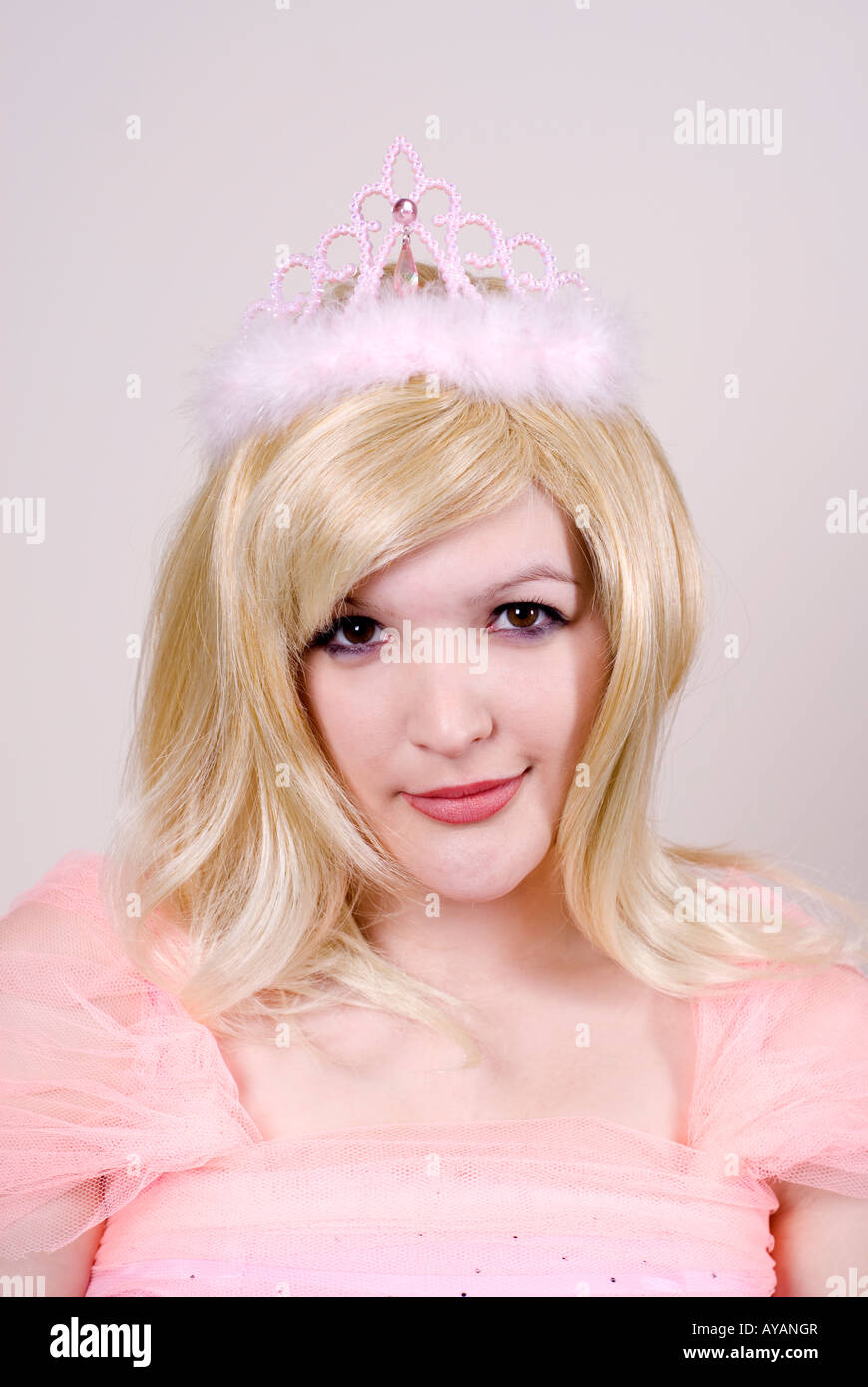 Portrait of a beautiful blonde woman wearing pink tiara Stock Photo