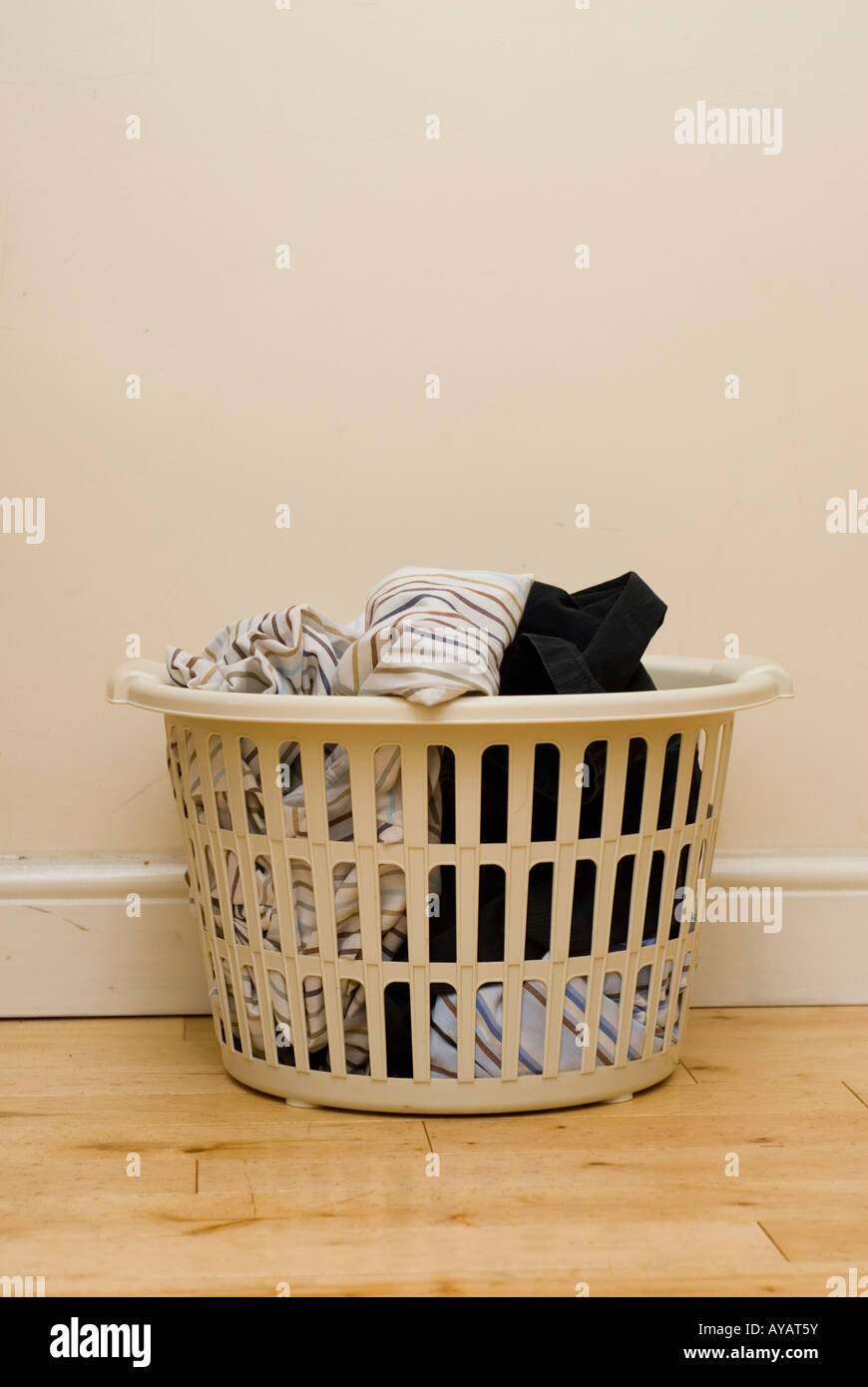Laundry basket full with cloths Stock Photo Alamy