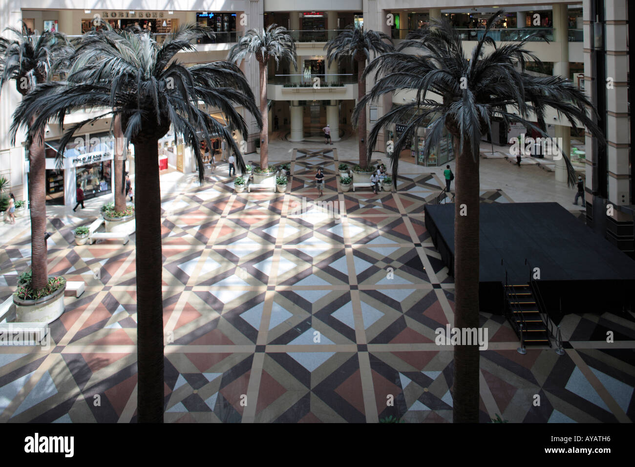 Asia Singapore Interior view of shopping atrium inside Raffles City ...