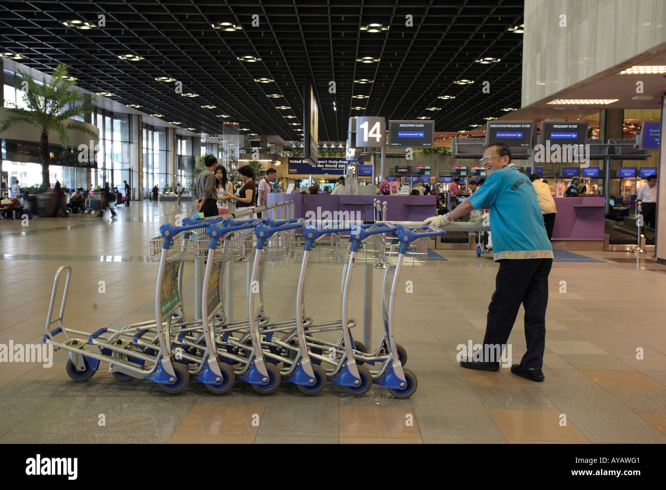 Asia Singapore Luggage carts inside passenger terminal at Changi