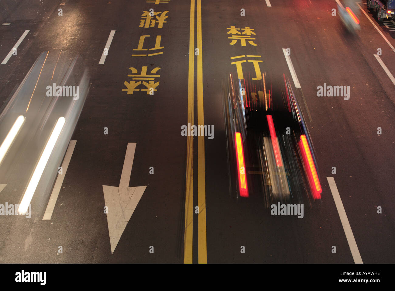 Taiwan Taipei Overhead view of chinese language road markings on street outside Taipei 101 building at night Stock Photo