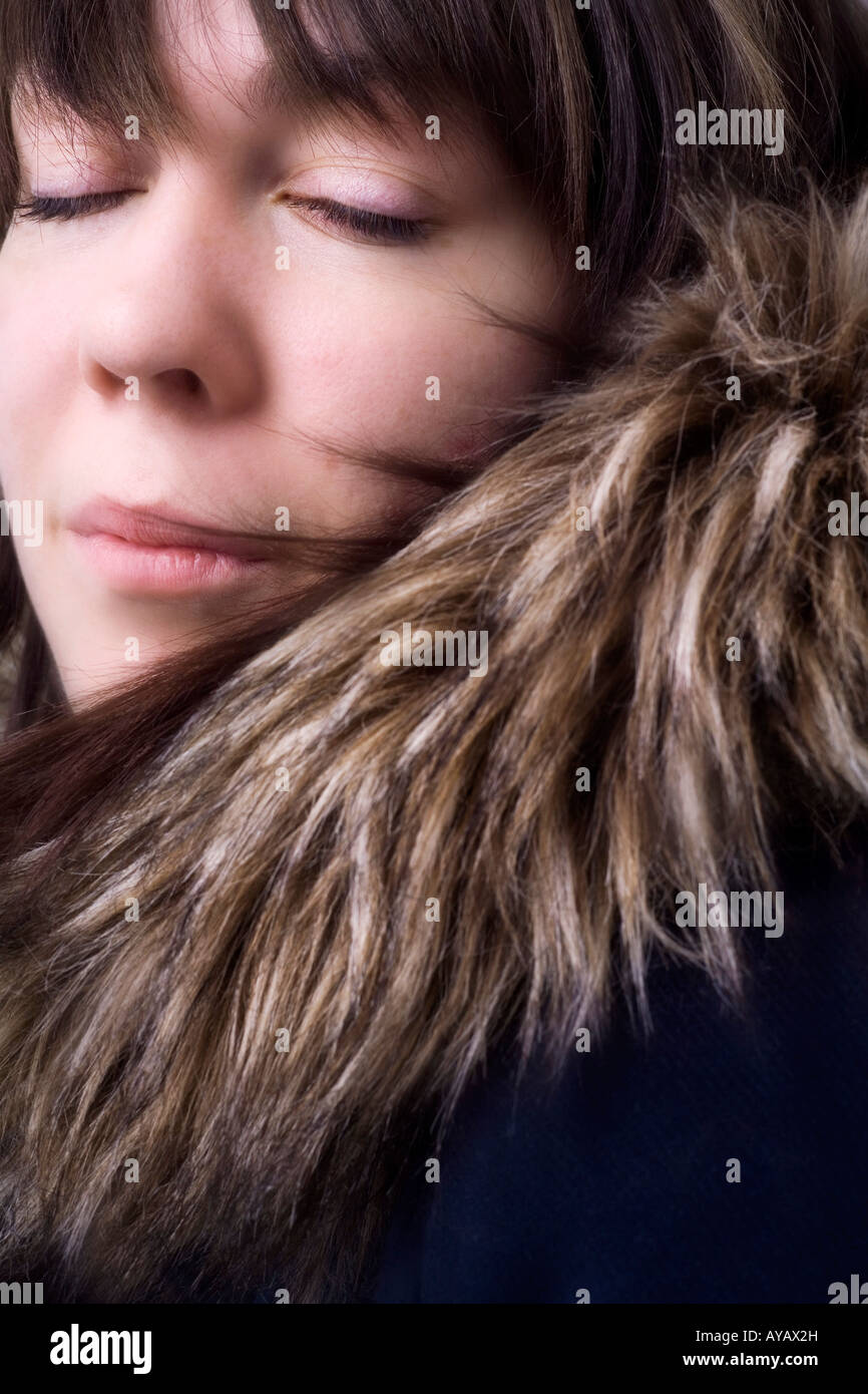 Portrait of woman with furry coat Stock Photo