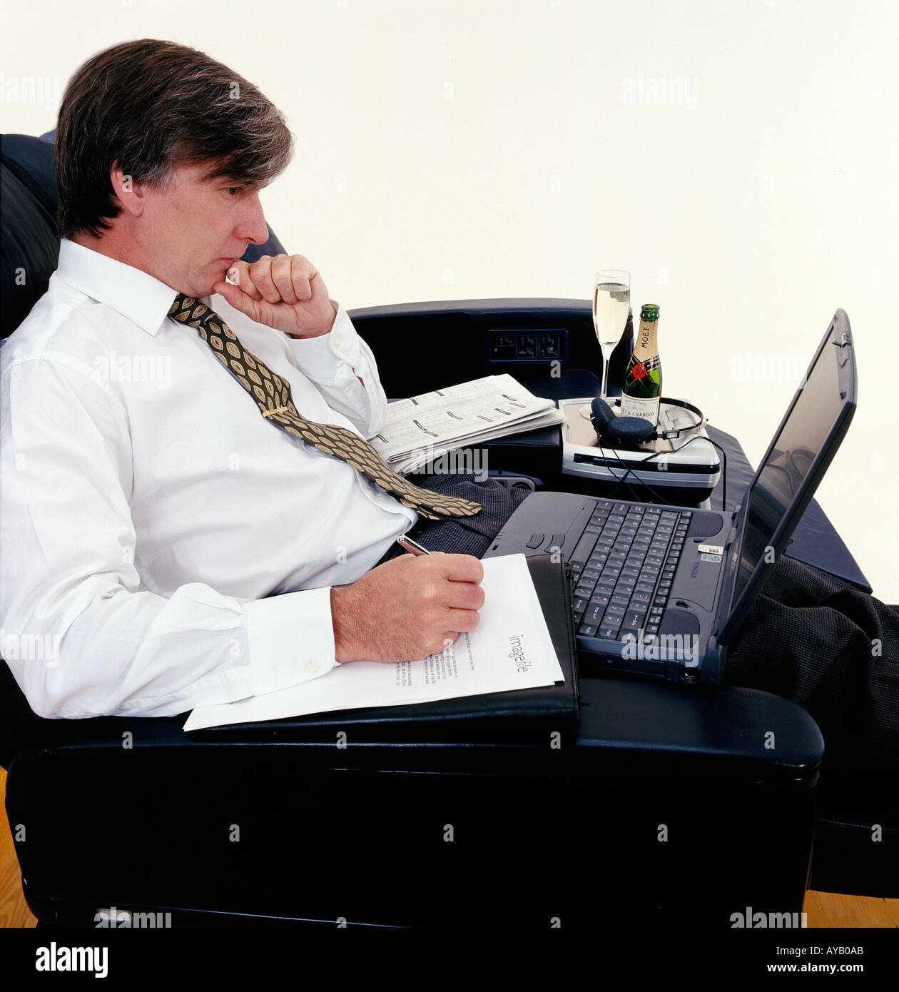 Busnees Executive travelling using laptop Stock Photo