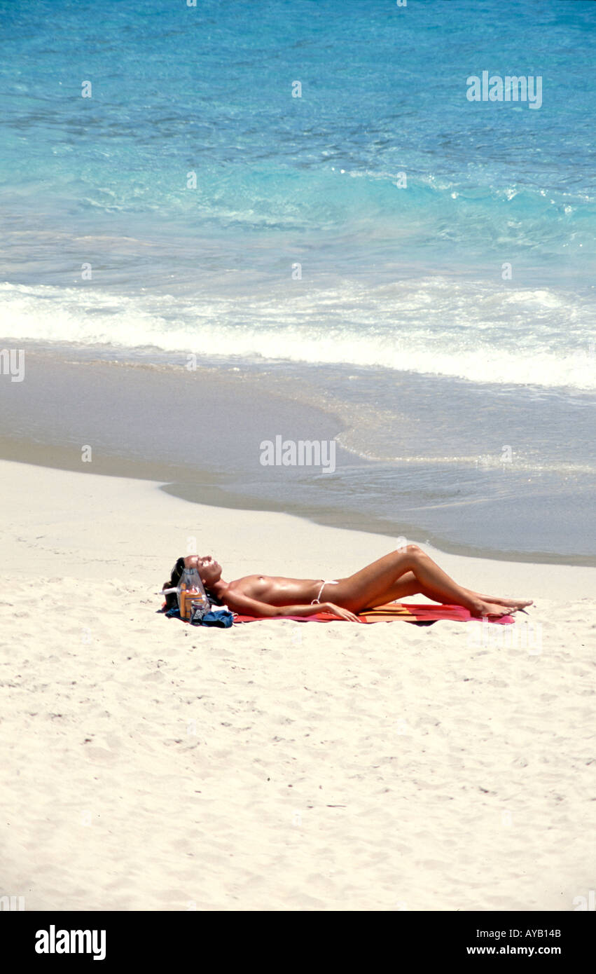 Sunbathing Topless in the French Caribbean St Barthelemy Stock Photo - Alamy