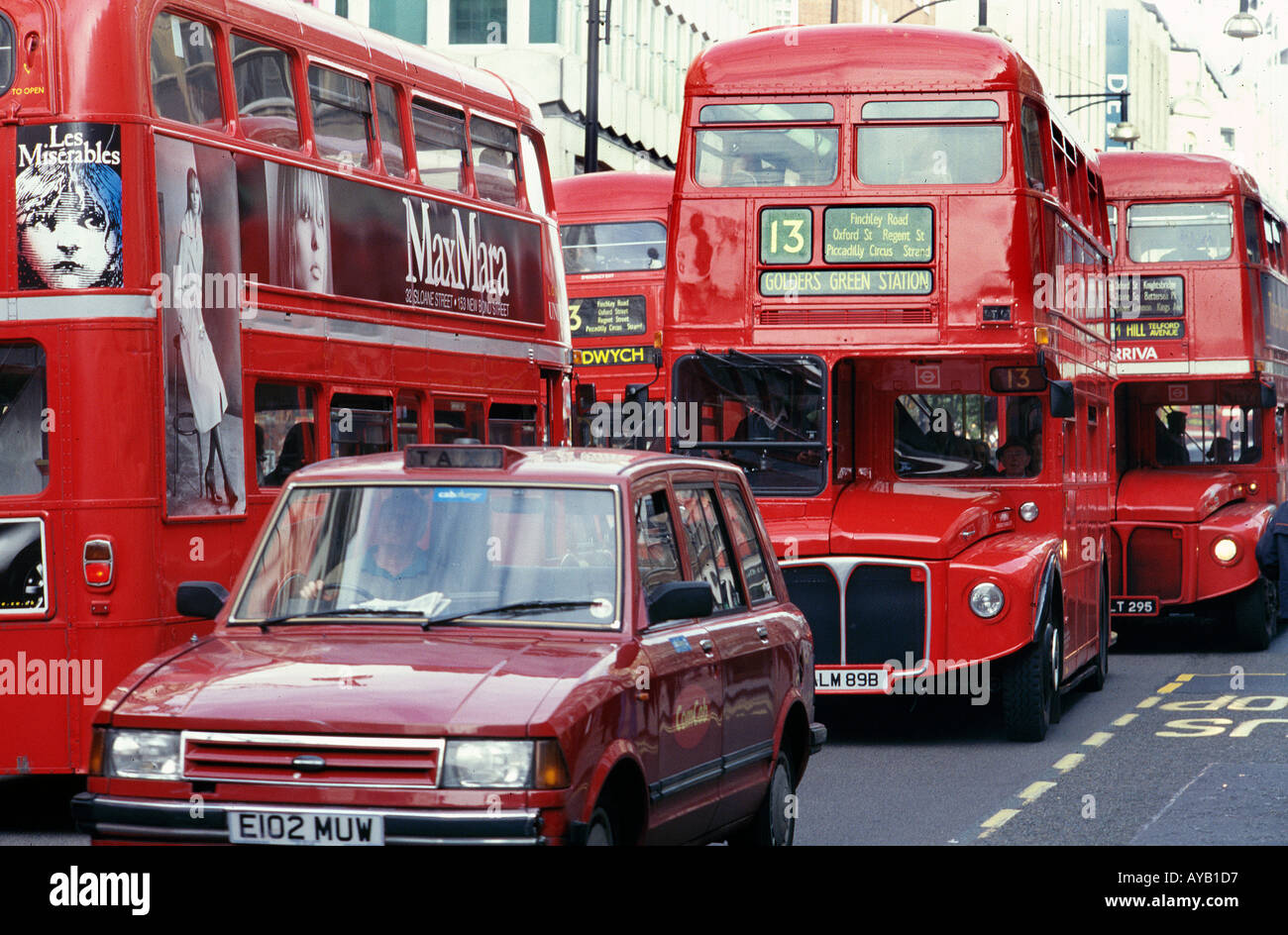 London Buses and Taxi Cab in Oxford Street London Stock Photo