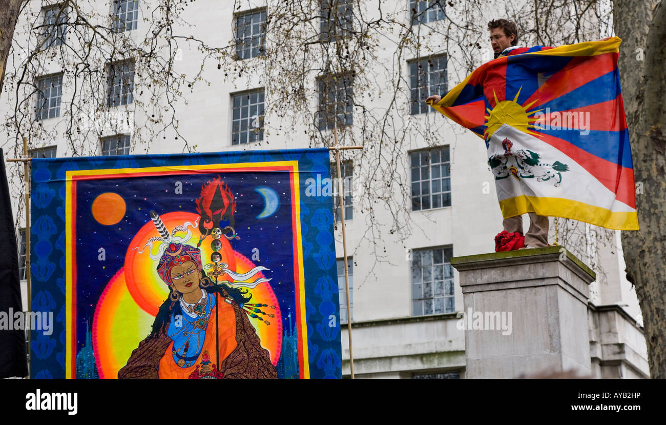 Man Standing On Podium Wearing Tibetan Flag  At The Free Tibet Demo Against The Chinese Olympics London U.K. Europe Stock Photo