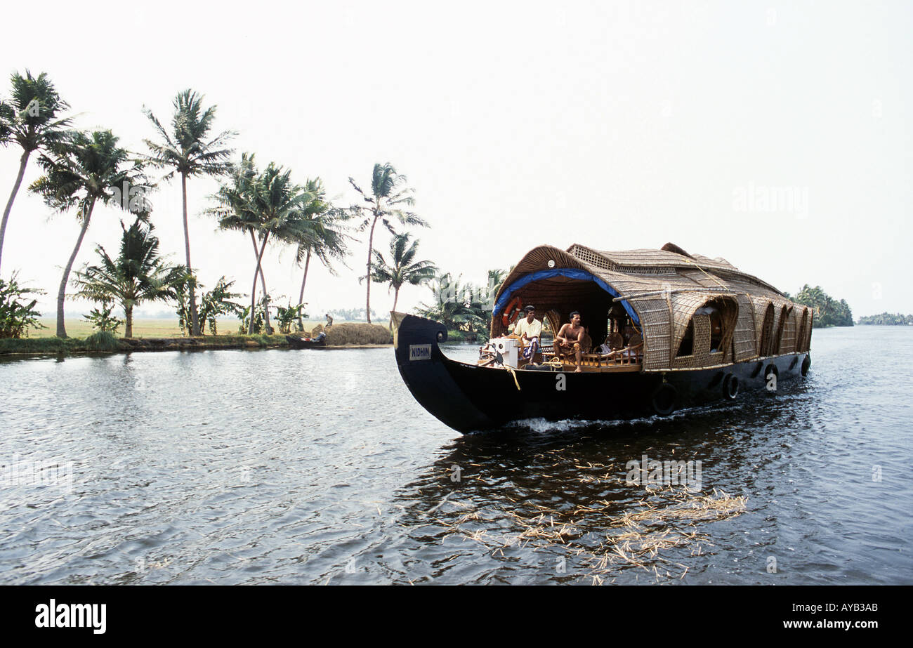 Cochin Kerala .  Tourist Boat on the wide calm rivers amongst  the farming land  and winding waterways. Stock Photo