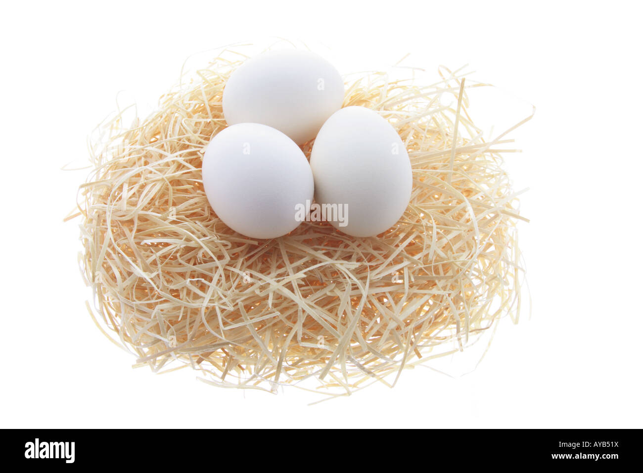 White Eggs on Straw Nest Stock Photo