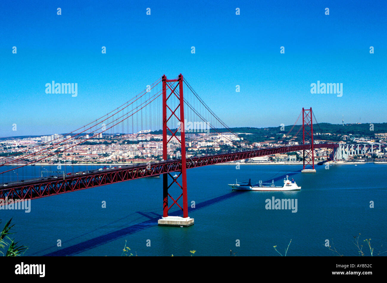 26th August Suspension bridge carries traffic and trains to the south of Portugal from Lisbon Stock Photo