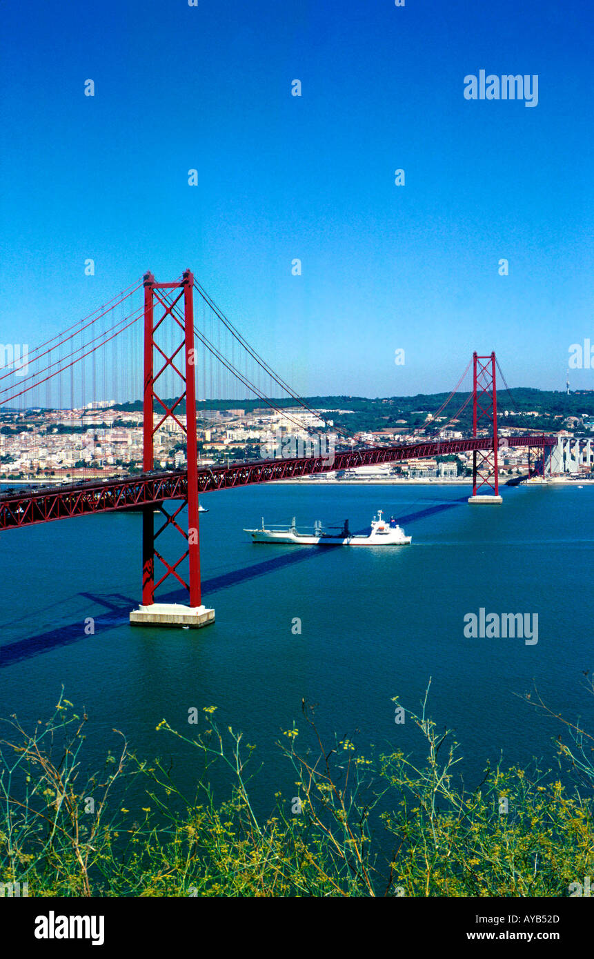 Suspension bridge carries traffic and trains to the south of Portugal from Lisbon Stock Photo