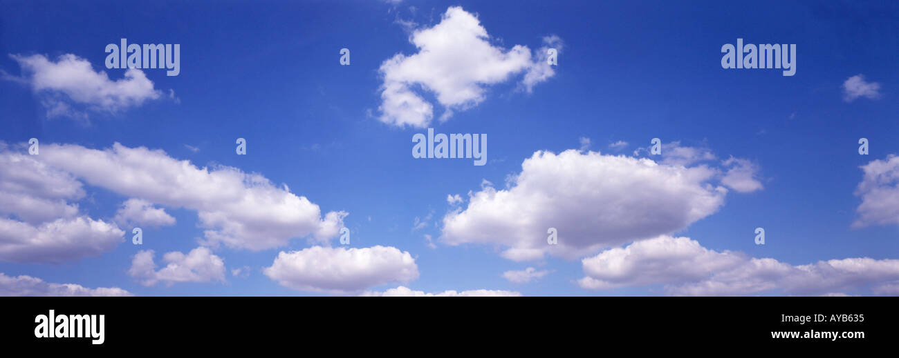 Fluffy clouds in blue sky hi-res stock photography and images - Alamy
