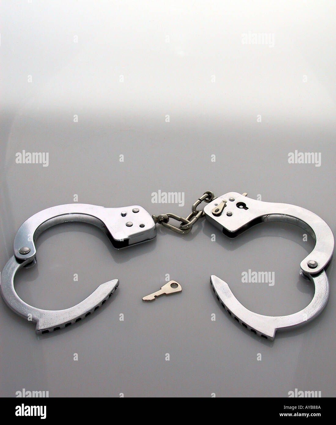 Handcuffs with key Stock Photo Alamy