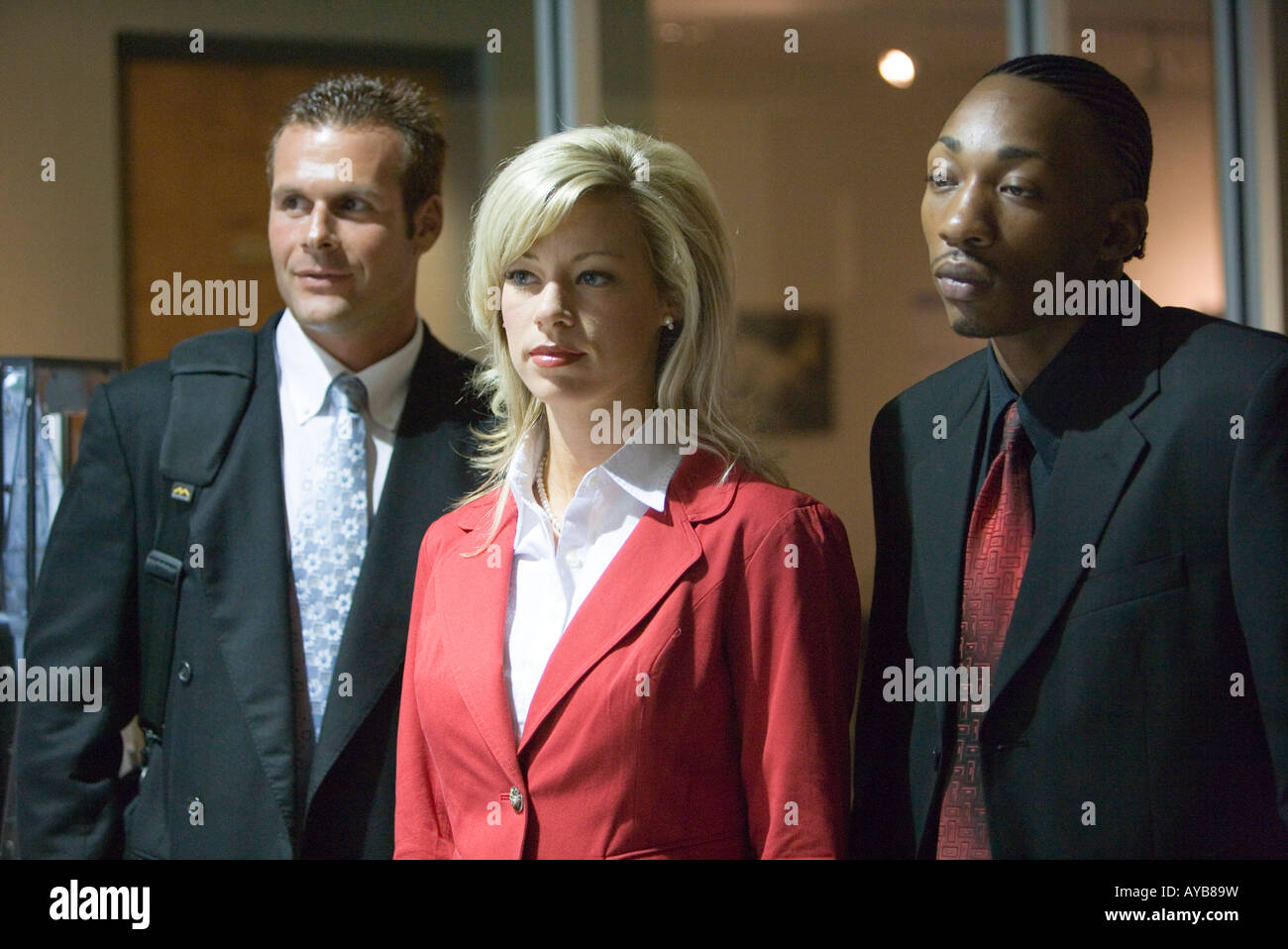 Business people standing in an office hallway Stock Photo - Alamy