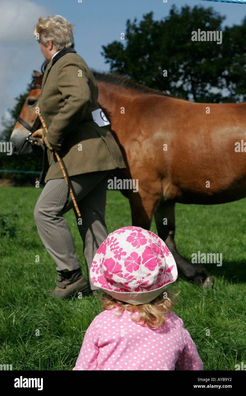 Girl watching show pony Stock Photo