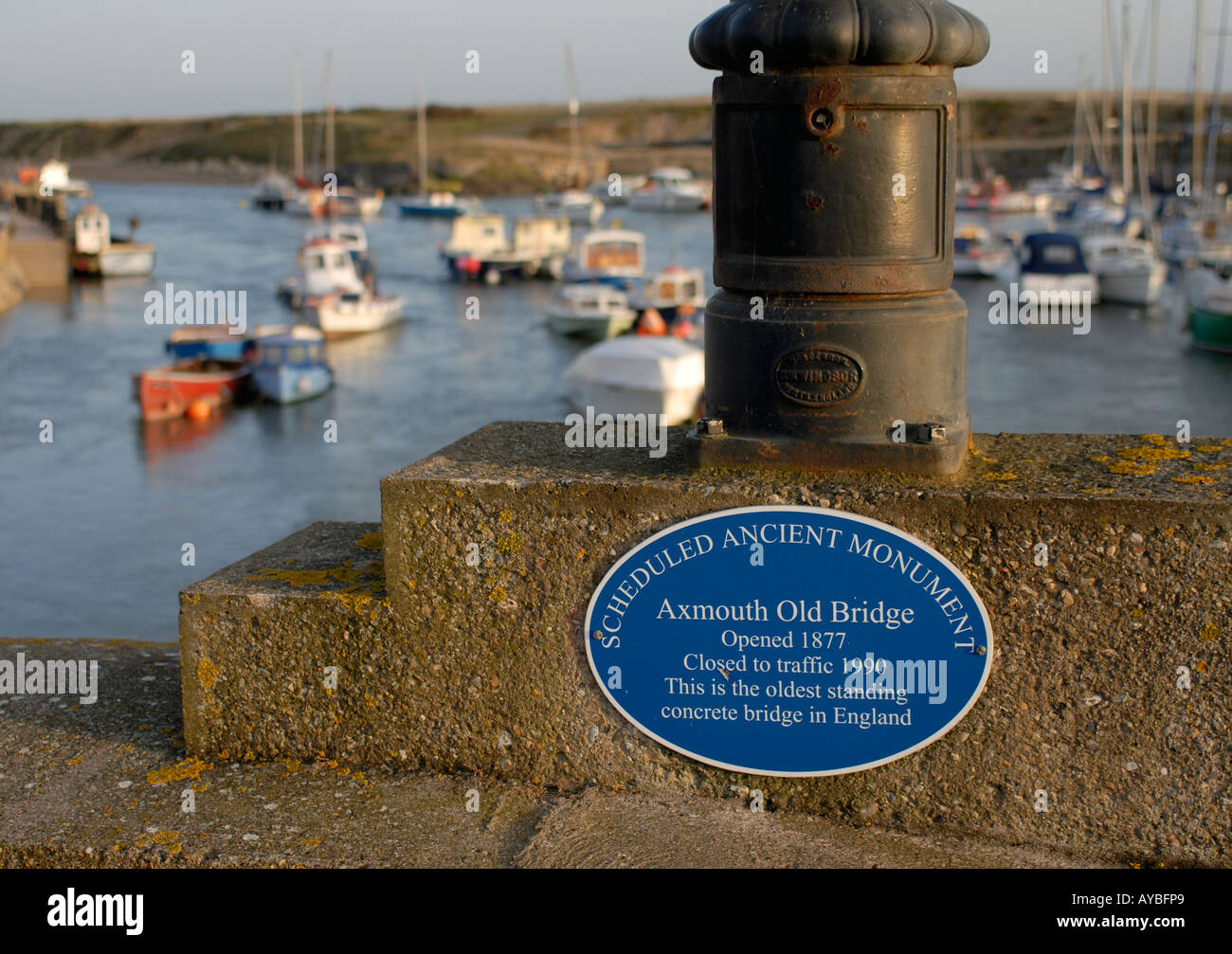 Blue plaque saying Scheduled Ancient Monument Axmouth Old Bridge Opened 1877 Closed to Traffic 1990 Stock Photo
